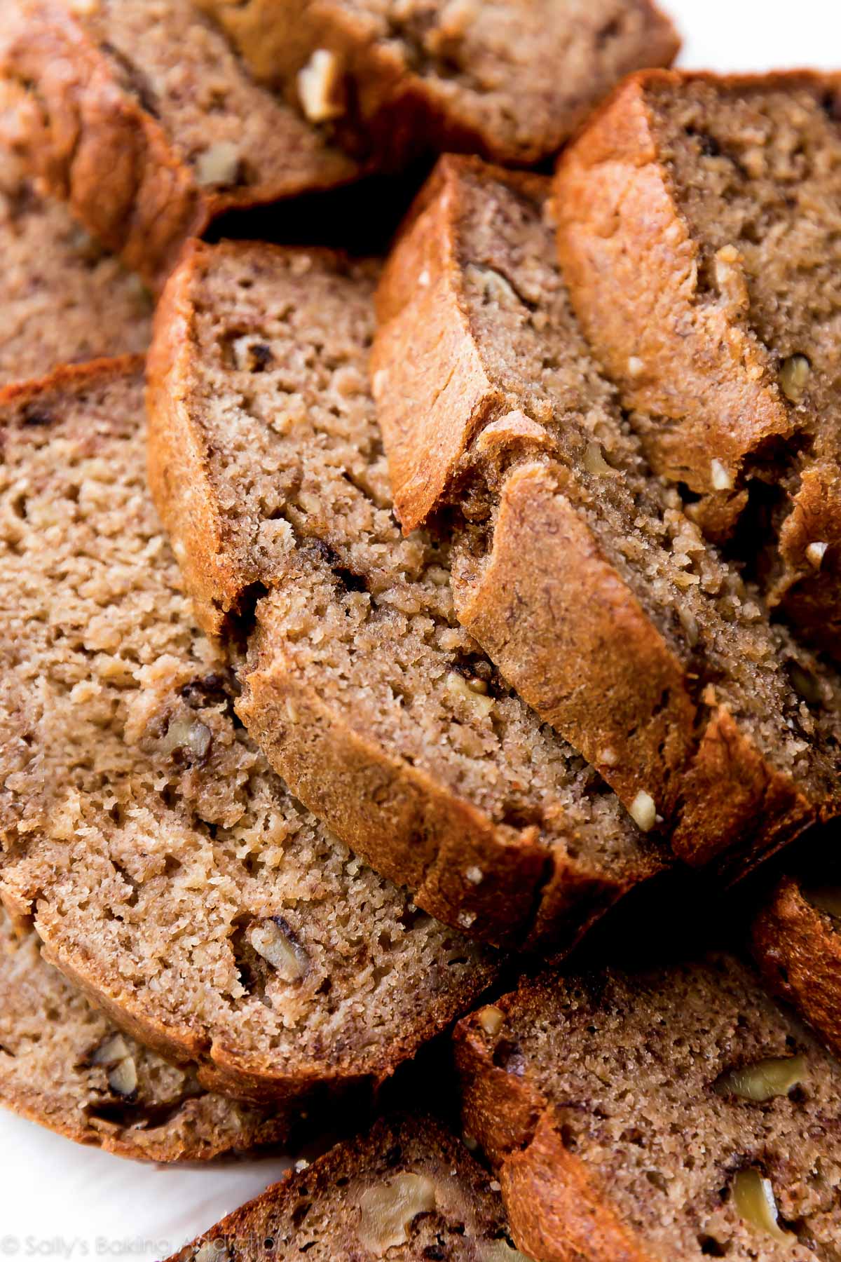 picture of banana bread with bananas, nuts, and cinnamon on top